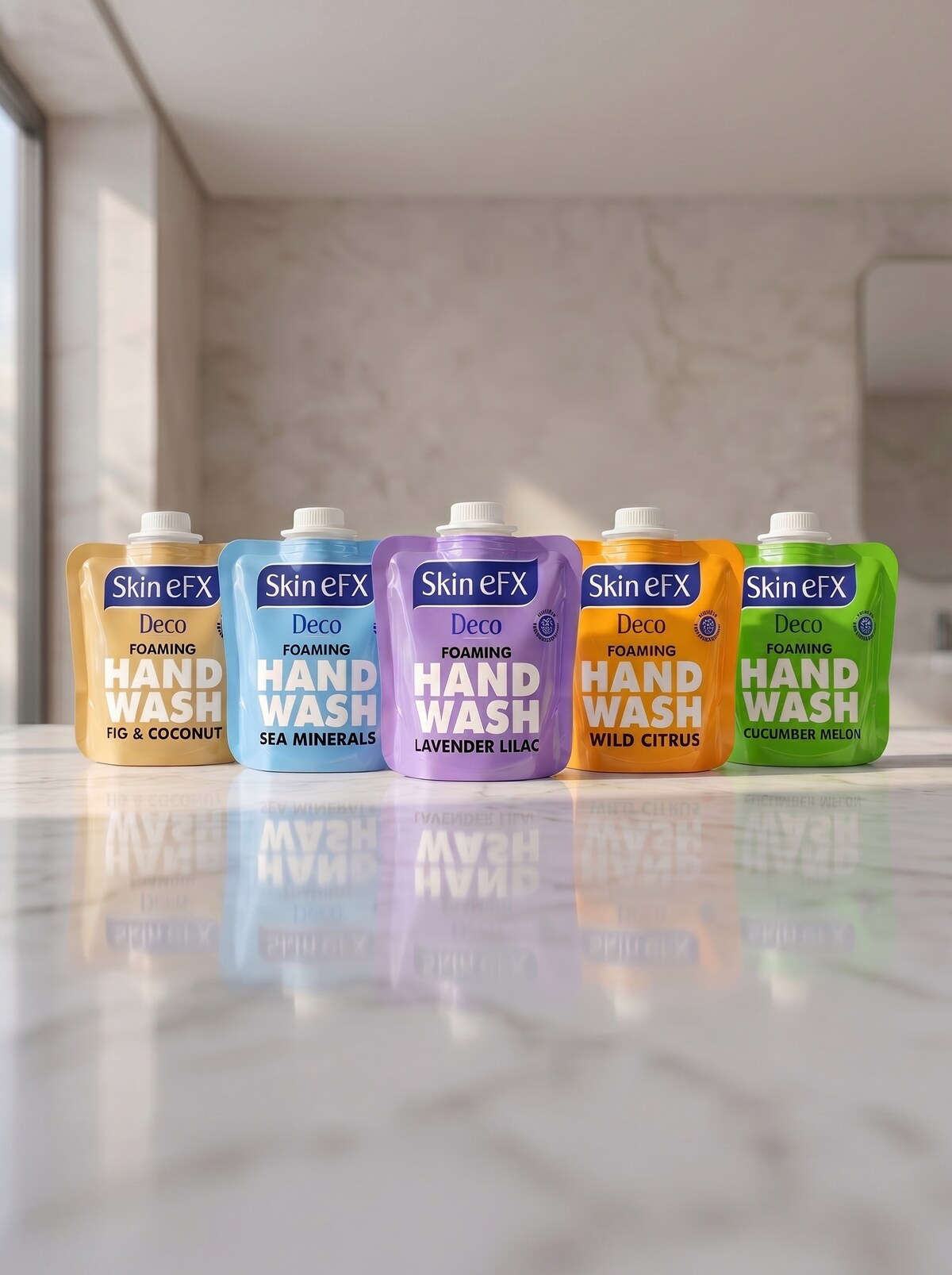 Skin eFX Deco Foaming Hand Wash refill pouches in all five fragrances on a marble countertop